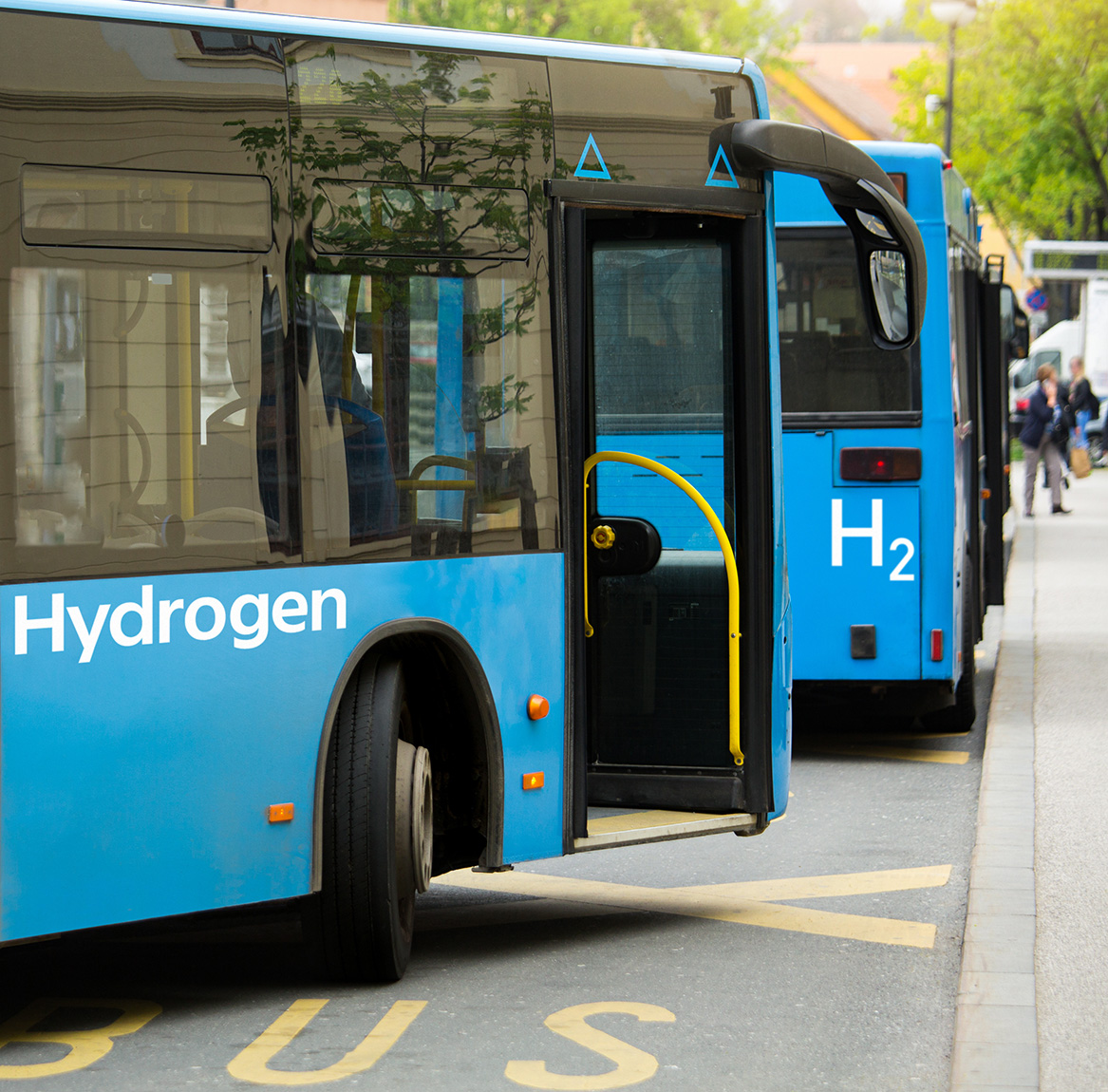 Green Hydrogen Bus A blue public transportation bus running on hydrogen energy produced in an energy recovery facility