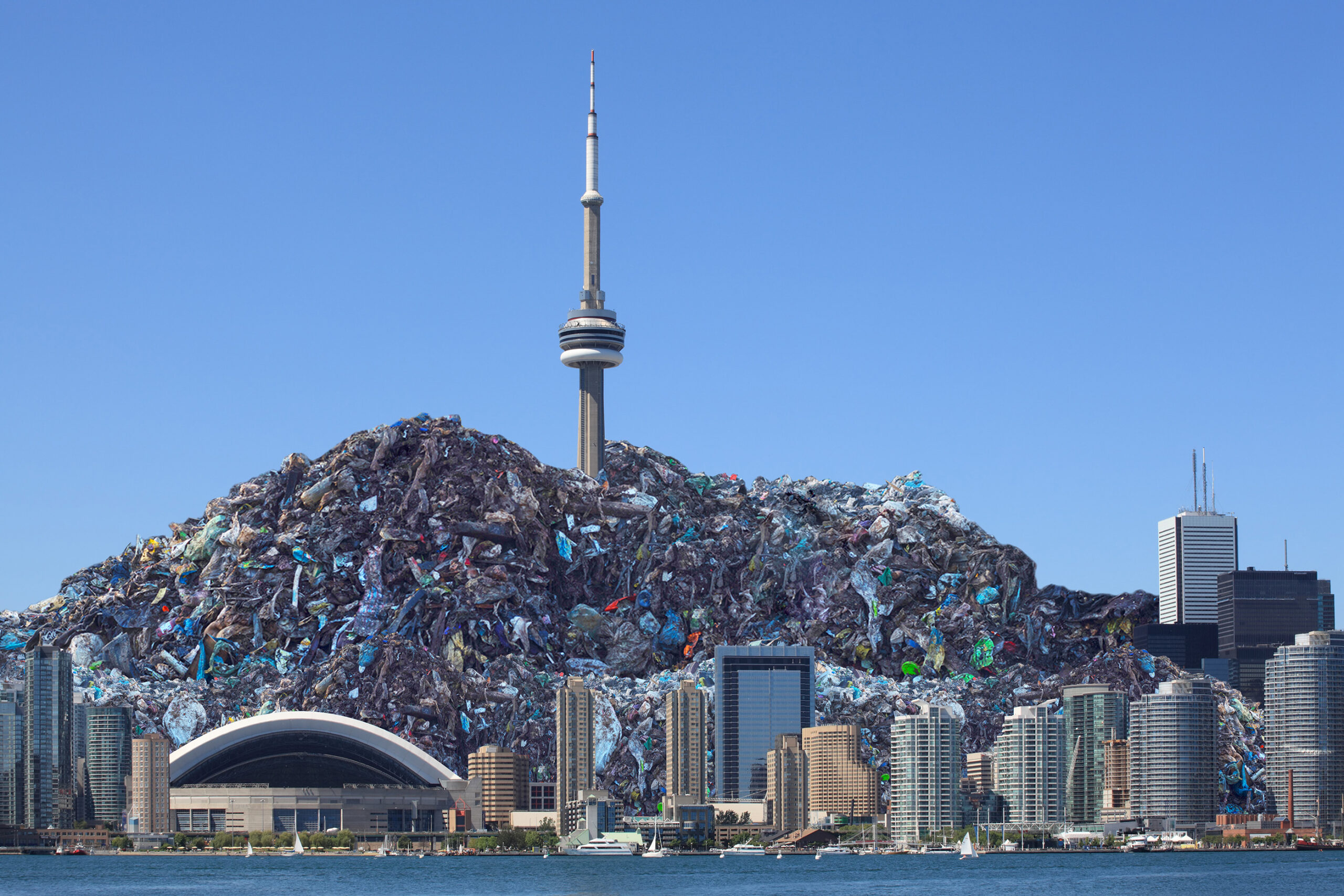 Toronto skyline with a large pile of garbage consuming the CN tower in the middle to represent Ontario's waste disposal services crisis